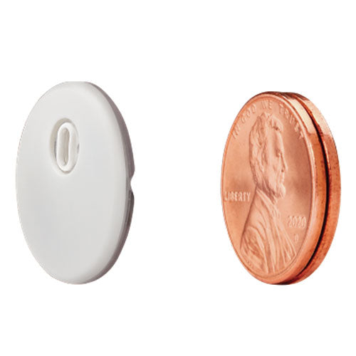Eargo hearing aid compared to the size of a penny