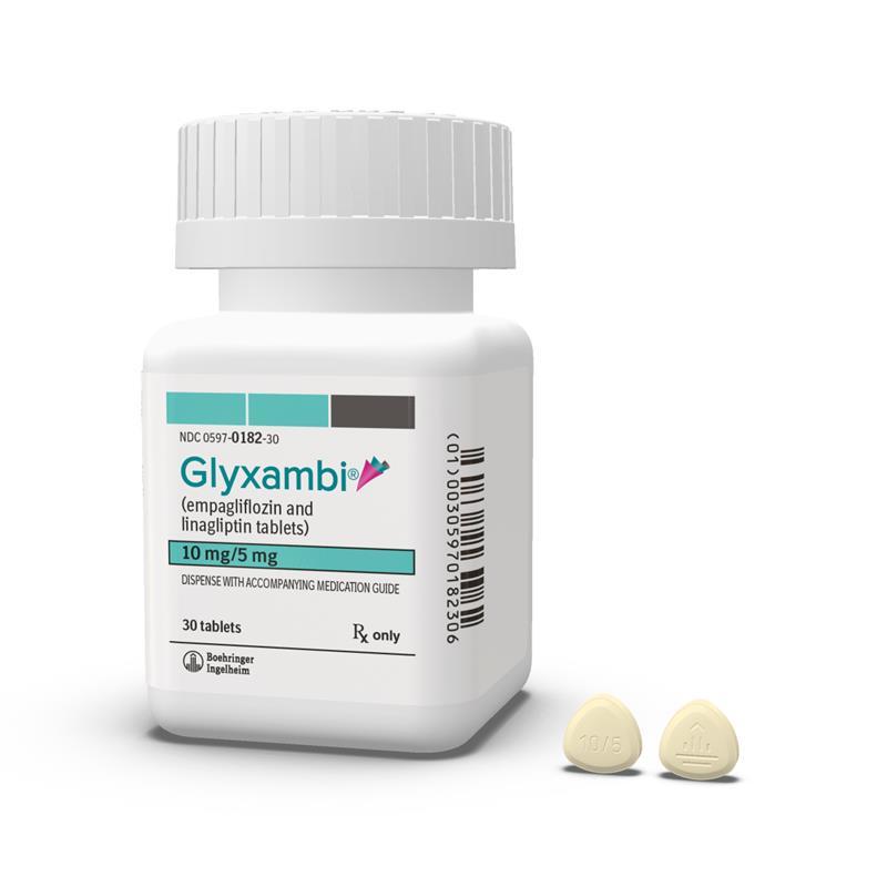 Glyxambi 10 mg/5 mg medication bottle and two light yellow tablets.