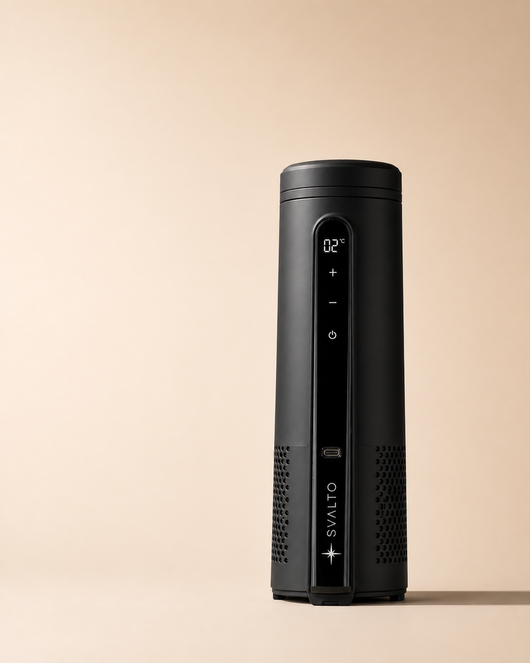 Black cylindrical device with a digital screen and control buttons on a light beige background.