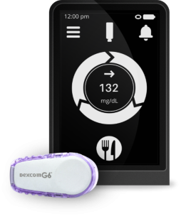 Dexcom G6 and receiver screen displaying glucose level.