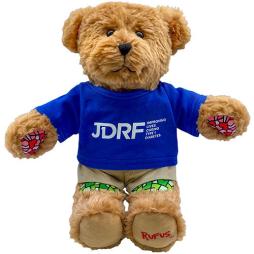 Teddy bear wearing a blue JDRF shirt.
