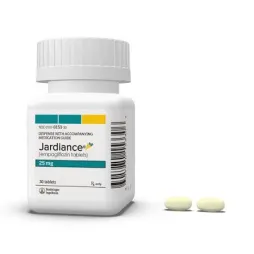 Jardiance 25 mg medication bottle with two light yellow oval pills next to it.