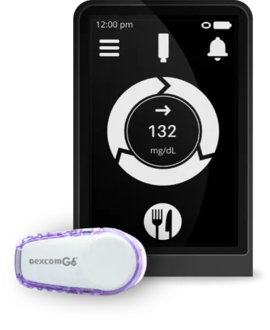Dexcom G6 and receiver screen displaying glucose level.
