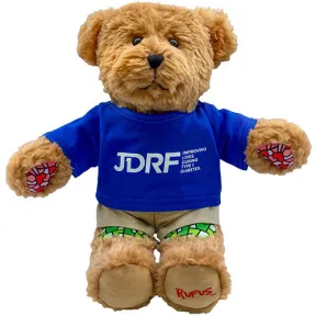 Teddy bear wearing a blue JDRF shirt.
