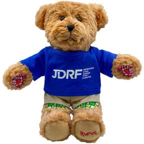 Teddy bear wearing a blue JDRF shirt.
