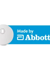 Round Instinct CGM sensor with manufacturer Abbott's logo