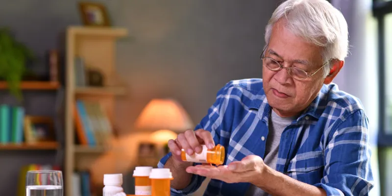 senior man with pill