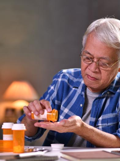 senior man with pill